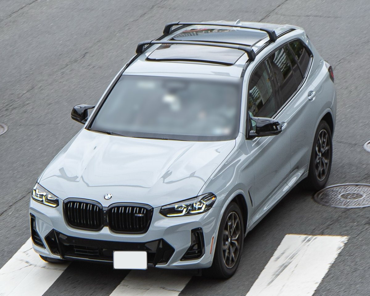 Overhead front three-quarter view of a Brooklyn Grey 2022 BMW X3 M40i with roof rails